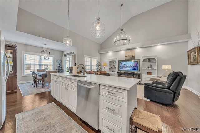 9443 Heritage Path Unit B, Clarence, NY 14032 - kitchen featuring dishwasher, a chandelier, open floor plan, light countertops, and high vaulted ceiling