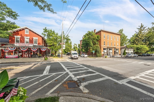 9443 Heritage Path Unit B, Clarence, NY 14032 - view of asphalt road with sidewalks, street lights, curbs, and traffic signs