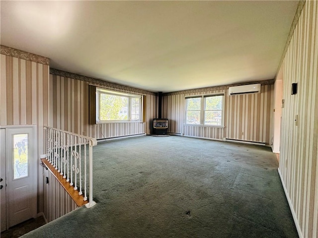 55 Wegman St, Sennett, NY 13021 - unfurnished living room with a wall mounted air conditioner, a wood stove, wallpapered walls, carpet floors, and plenty of natural light