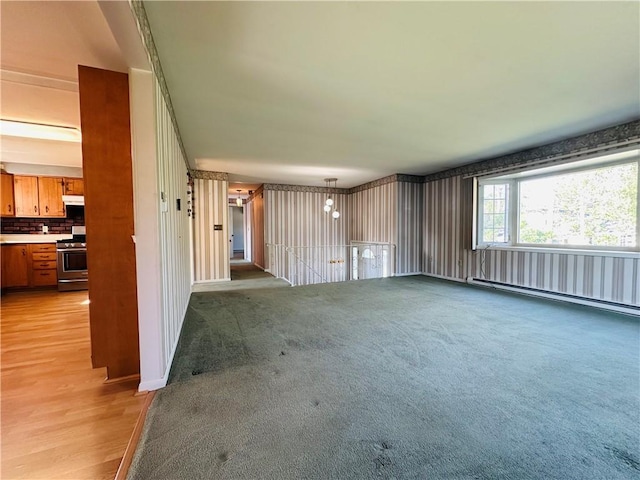 55 Wegman St, Sennett, NY 13021 - unfurnished living room featuring a baseboard heating unit