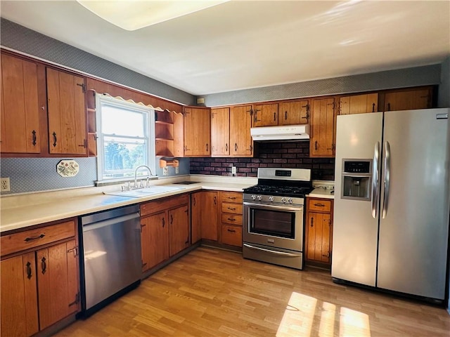 55 Wegman St, Sennett, NY 13021 - kitchen with appliances with stainless steel finishes, open shelves, under cabinet range hood, light wood-style flooring, and light countertops