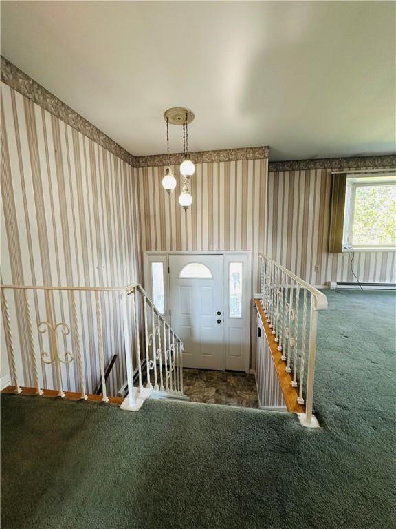 55 Wegman St, Sennett, NY 13021 - carpeted foyer entrance featuring wallpapered walls and a baseboard heating unit