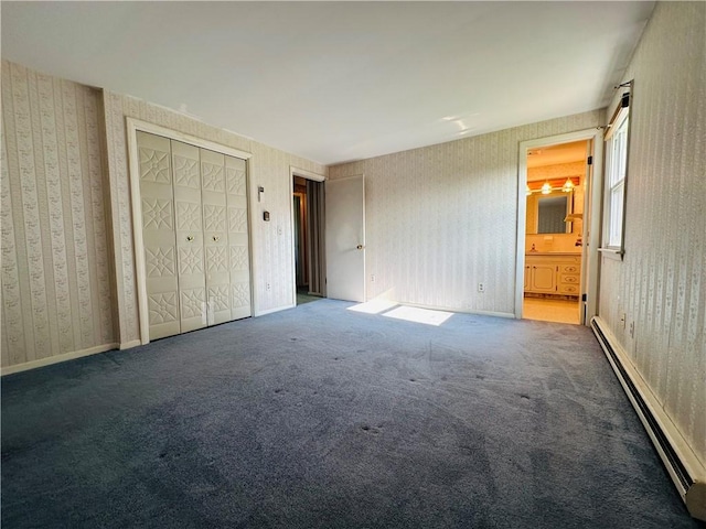 55 Wegman St, Sennett, NY 13021 - unfurnished bedroom featuring a baseboard heating unit, wallpapered walls, carpet floors, and ensuite bath