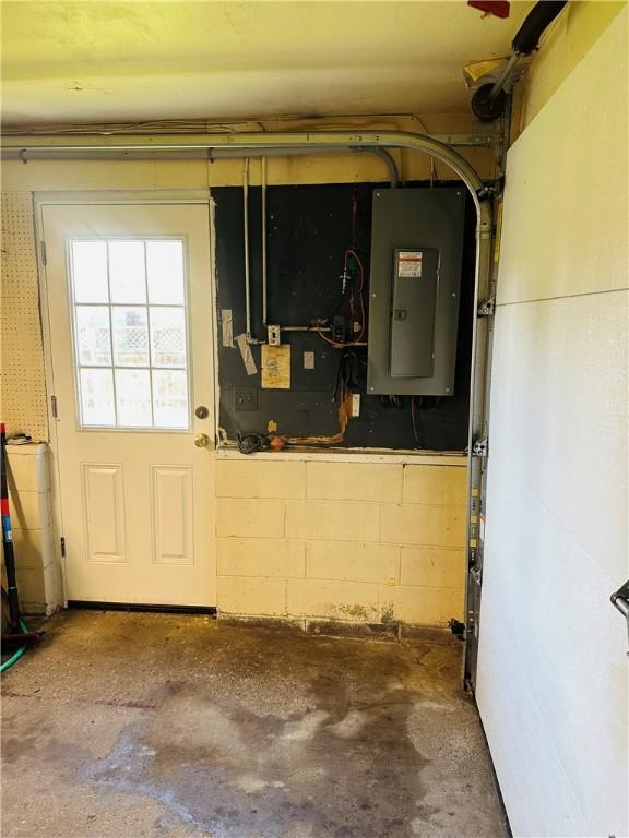 55 Wegman St, Sennett, NY 13021 - utility room featuring electric panel and a garage