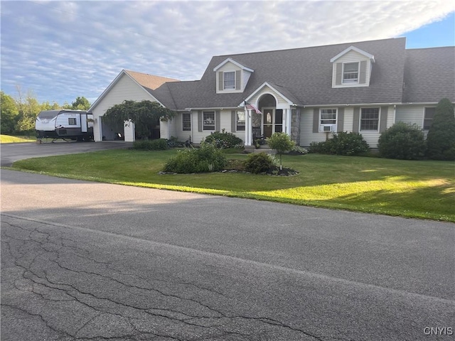 115 Meaney Cir, Scriba, NY 13126 - cape cod home with asphalt driveway, a front yard, a garage, and a shingled roof