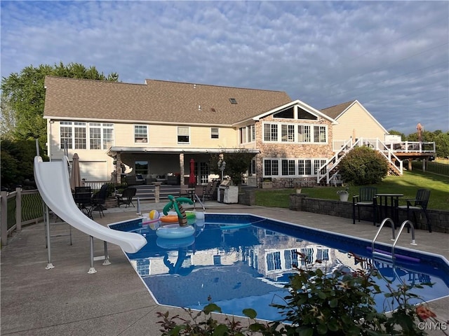 115 Meaney Cir, Scriba, NY 13126 - view of swimming pool featuring a water slide, a patio area, stairway, and a deck