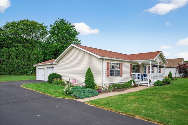 7219 Apple St, Bath, NY 14810 - single story home featuring covered porch, a front lawn, and a garage