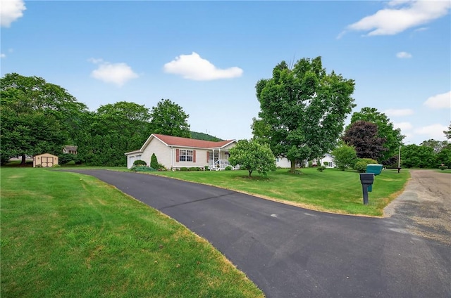 7219 Apple St, Bath, NY 14810 - ranch-style home featuring a storage unit and a front yard