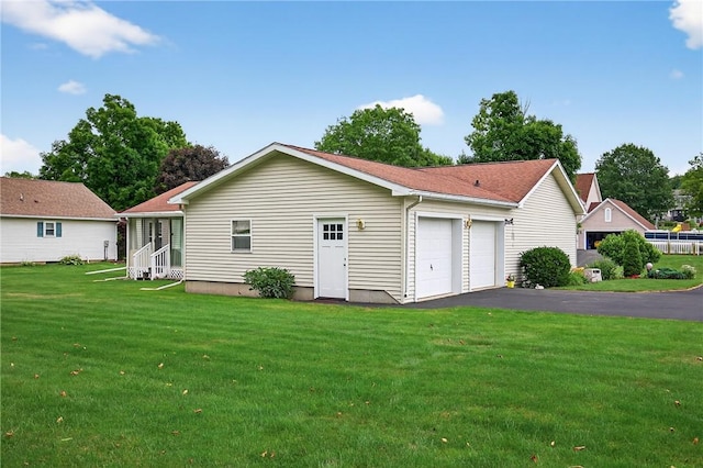7219 Apple St, Bath, NY 14810 - back of house with a garage and a lawn