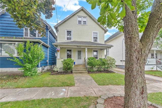11 7th Ave, North Tonawanda, NY 14120 - american foursquare style home featuring covered porch and a front lawn