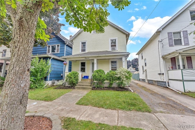 11 7th Ave, North Tonawanda, NY 14120 - view of front of home featuring covered porch and a front yard