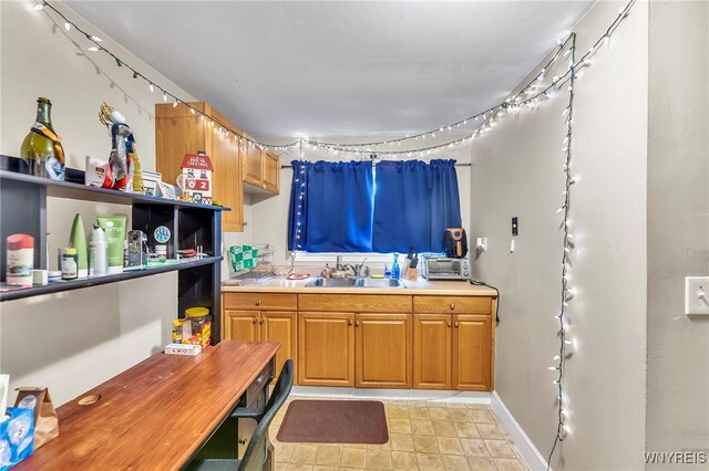 11 7th Ave, North Tonawanda, NY 14120 - kitchen featuring light countertops and brown cabinets
