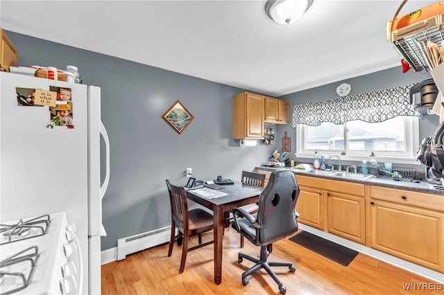 11 7th Ave, North Tonawanda, NY 14120 - kitchen featuring white gas range, a baseboard heating unit, light wood-style floors, and light brown cabinets
