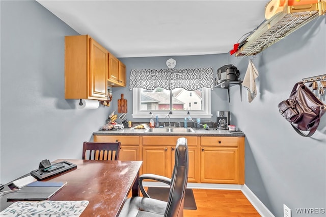 11 7th Ave, North Tonawanda, NY 14120 - kitchen with light wood-style floors and dark countertops