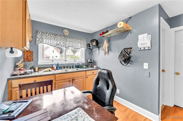 11 7th Ave, North Tonawanda, NY 14120 - kitchen with light wood-style floors, dark countertops, and a desk
