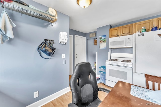 11 7th Ave, North Tonawanda, NY 14120 - kitchen featuring white appliances, light wood-style floors, and an office area