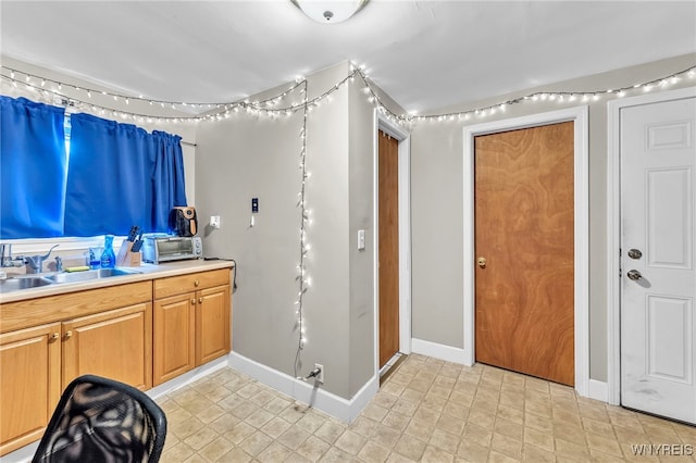 11 7th Ave, North Tonawanda, NY 14120 - kitchen with baseboards and light countertops