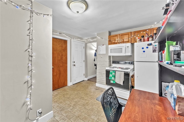 11 7th Ave, North Tonawanda, NY 14120 - kitchen featuring white appliances, brown cabinets, light floors, and light countertops