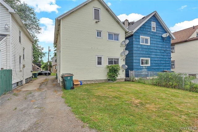11 7th Ave, North Tonawanda, NY 14120 - rear view of house featuring a chimney and driveway
