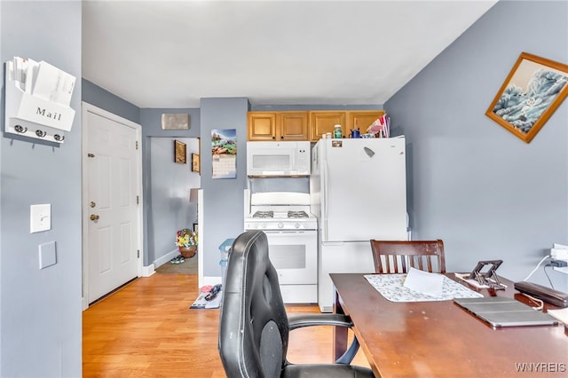 11 7th Ave, North Tonawanda, NY 14120 - kitchen featuring white appliances, light wood-style floors, and a desk