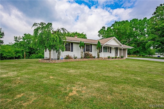 283 Erin Rd, Ridgeway, NY 14103 - ranch-style home featuring a garage, driveway, a front lawn, and a chimney
