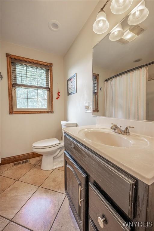 283 Erin Rd, Ridgeway, NY 14103 - bathroom with vanity and tile patterned flooring