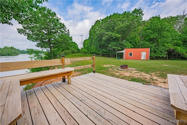 283 Erin Rd, Ridgeway, NY 14103 - wooden deck with a yard, a fire pit, an outdoor structure, and a water view