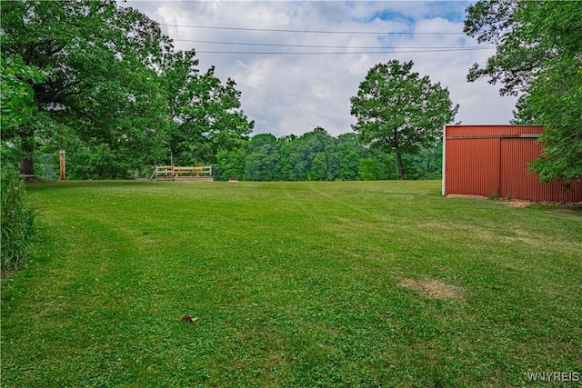 283 Erin Rd, Ridgeway, NY 14103 - view of grassy yard with a pole building and an outbuilding