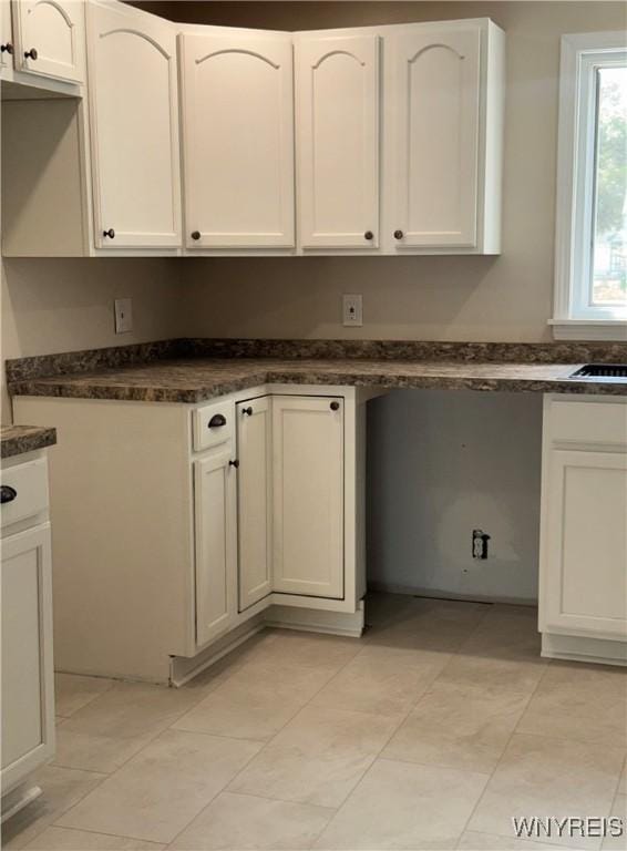 129 Brookside Dr, West Seneca, NY 14220 - kitchen featuring dark countertops and white cabinets