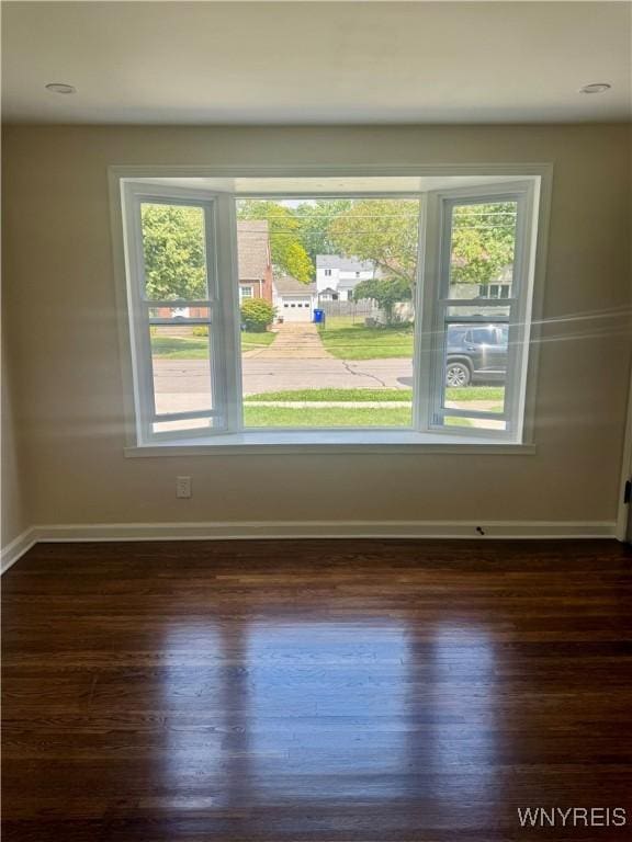 129 Brookside Dr, West Seneca, NY 14220 - spare room featuring dark wood finished floors and healthy amount of natural light