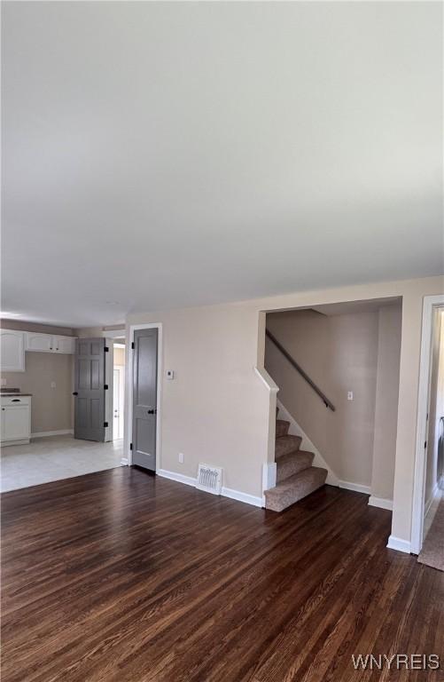 129 Brookside Dr, West Seneca, NY 14220 - unfurnished living room with wood finished floors and stairs