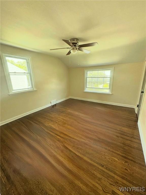 129 Brookside Dr, West Seneca, NY 14220 - unfurnished room featuring dark wood finished floors, a ceiling fan, and vaulted ceiling