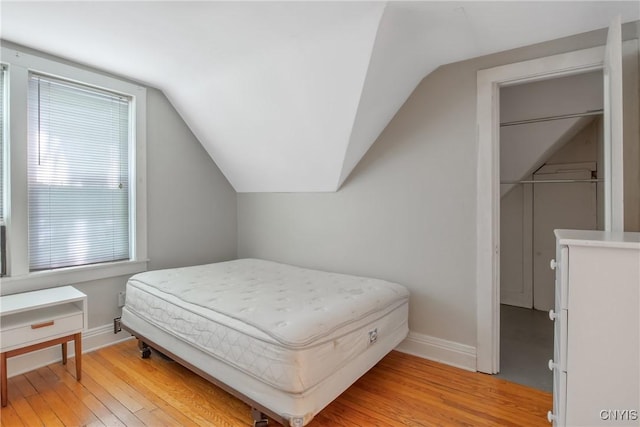 101 Comstock Ave, Syracuse, NY 13210 - bedroom featuring light wood finished floors and lofted ceiling