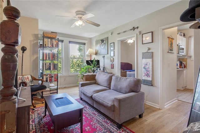 101 Comstock Ave, Syracuse, NY 13210 - living area with ceiling fan and light wood-style floors