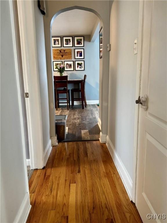 119 Marnie St, Deerfield, NY 13502 - hallway featuring arched walkways and wood finished floors