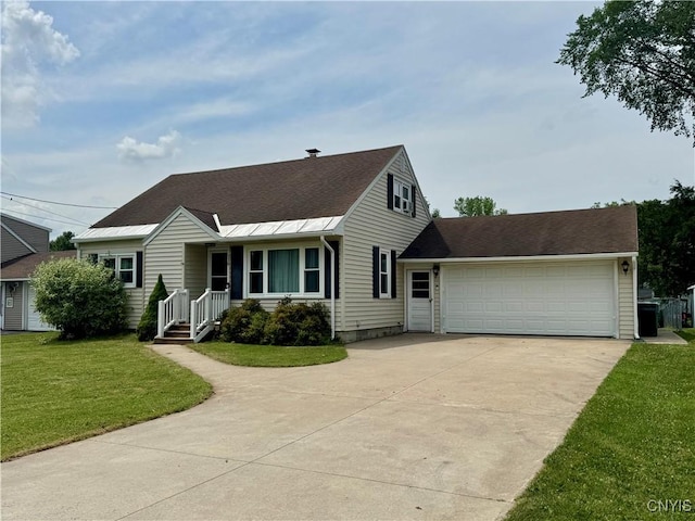119 Marnie St, Deerfield, NY 13502 - view of front of house with driveway, a garage, a front lawn, and roof with shingles