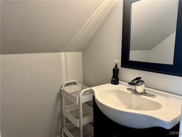 119 Marnie St, Deerfield, NY 13502 - bathroom with vaulted ceiling and vanity