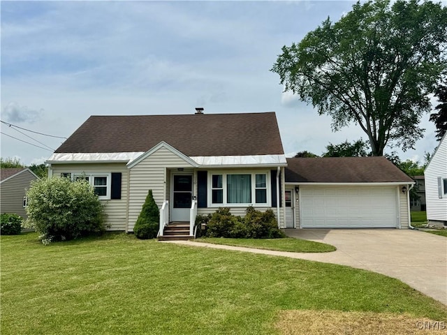 119 Marnie St, Deerfield, NY 13502 - view of front of property with concrete driveway, an attached garage, a front lawn, and a shingled roof