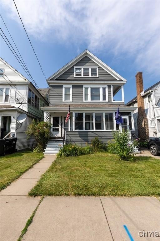 2228-30 Grant Blvd Unit 30, Syracuse, NY 13208 - american foursquare style home with a porch and a front yard