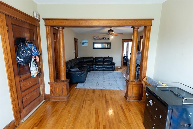 2228-30 Grant Blvd Unit 30, Syracuse, NY 13208 - living area with ornate columns, light wood-type flooring, and a ceiling fan
