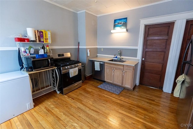 2228-30 Grant Blvd Unit 30, Syracuse, NY 13208 - kitchen with stainless steel appliances, light wood-style floors, ornamental molding, and light countertops