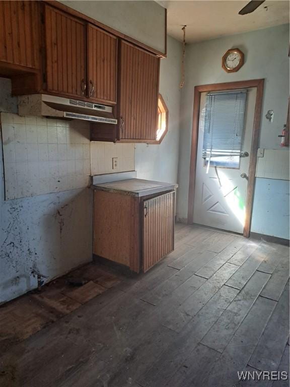 6 Grove St, Van Buren, NY 13027 - kitchen featuring wood finished floors, under cabinet range hood, and brown cabinets