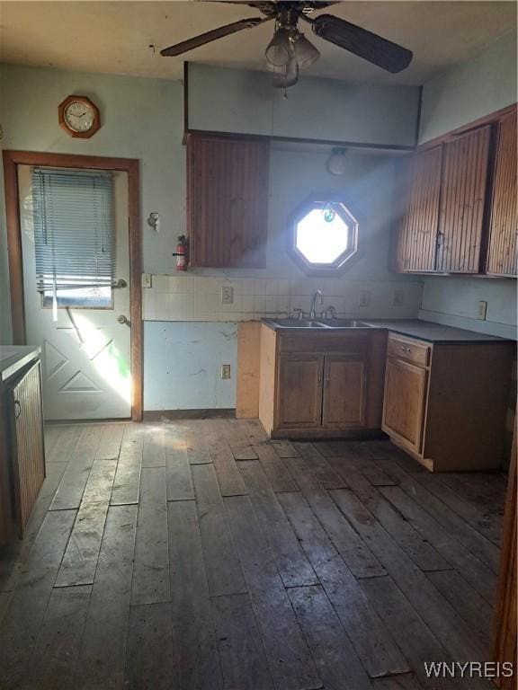 6 Grove St, Van Buren, NY 13027 - kitchen with a ceiling fan, dark wood-style flooring, and backsplash