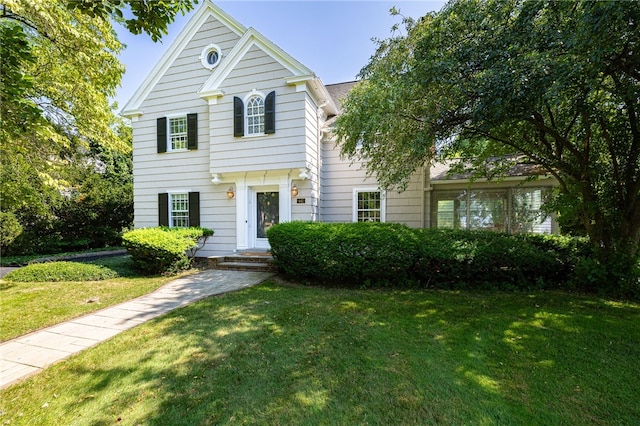 441 Claybourne Rd, Brighton, NY 14618 - view of front of property with a front yard and roof with shingles