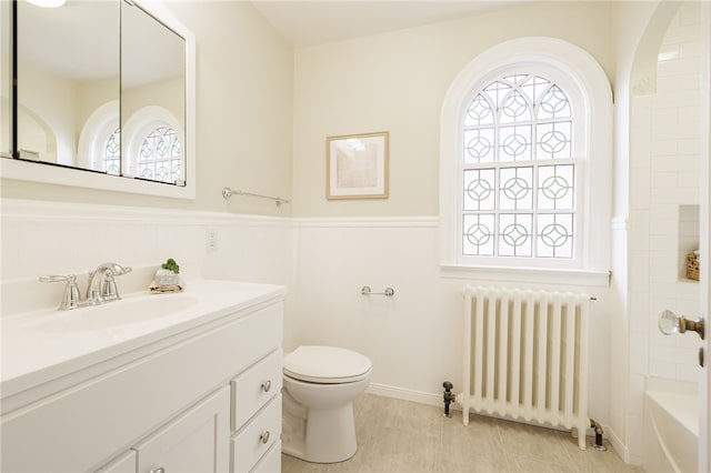 441 Claybourne Rd, Brighton, NY 14618 - bathroom with radiator heating unit, vanity, healthy amount of natural light, wainscoting, and shower / tub combination