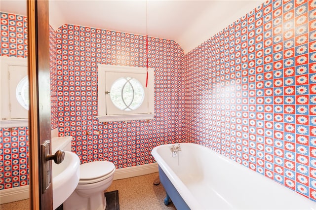 441 Claybourne Rd, Brighton, NY 14618 - bathroom with a soaking tub, vaulted ceiling, and wallpapered walls