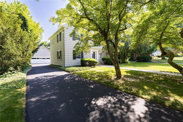 441 Claybourne Rd, Brighton, NY 14618 - colonial-style house featuring a detached garage, an outdoor structure, and a front lawn
