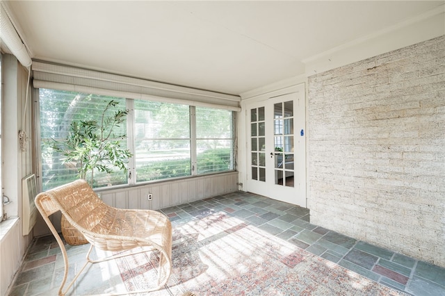 441 Claybourne Rd, Brighton, NY 14618 - unfurnished sunroom with stone tile floors and french doors