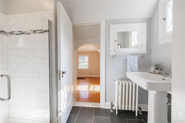 441 Claybourne Rd, Brighton, NY 14618 - bathroom featuring radiator heating unit, a shower stall, and tile patterned flooring