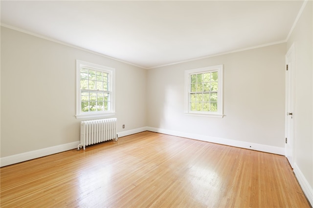 441 Claybourne Rd, Brighton, NY 14618 - unfurnished room with radiator heating unit, healthy amount of natural light, crown molding, and light wood-style flooring